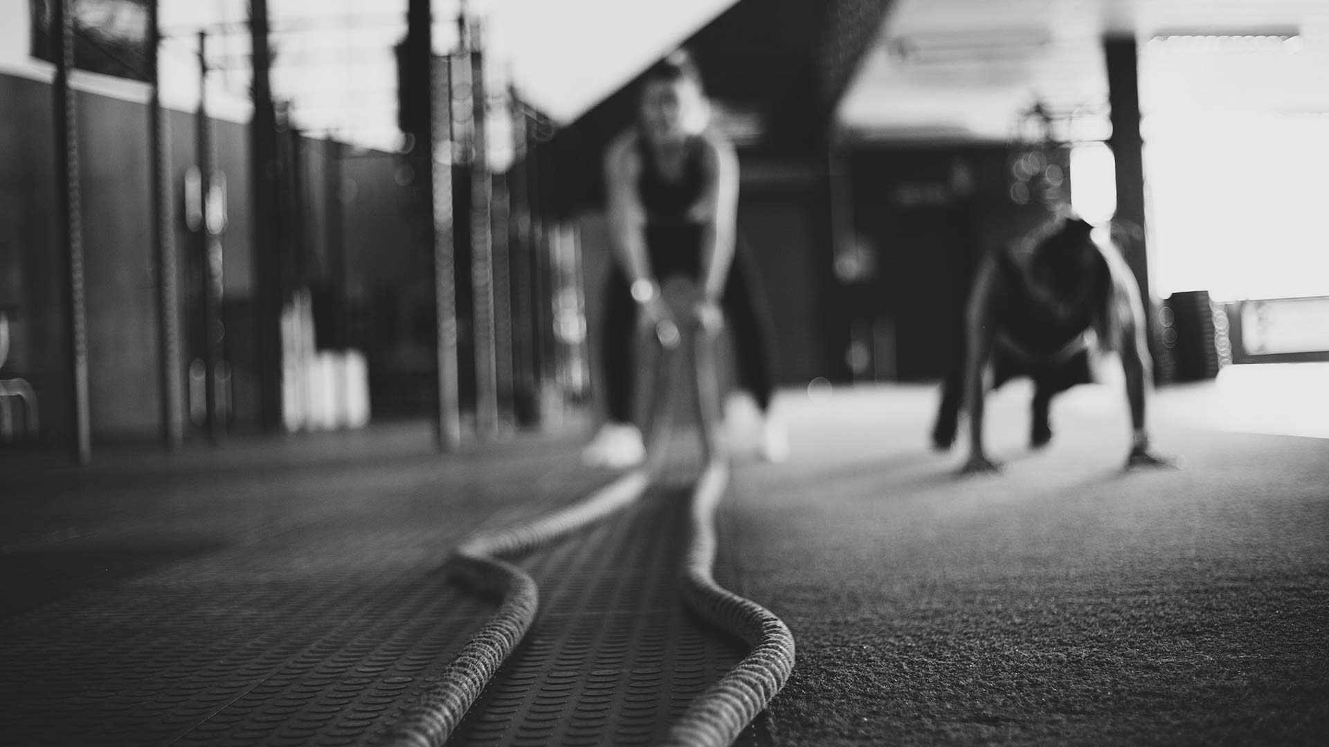 two people working out with pushups and ropes